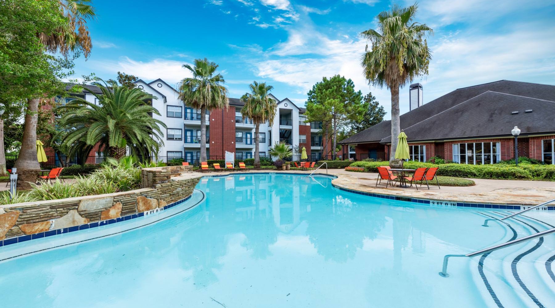 a swimming pool in front of a building